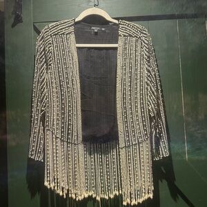 Pearl beaded blazer.